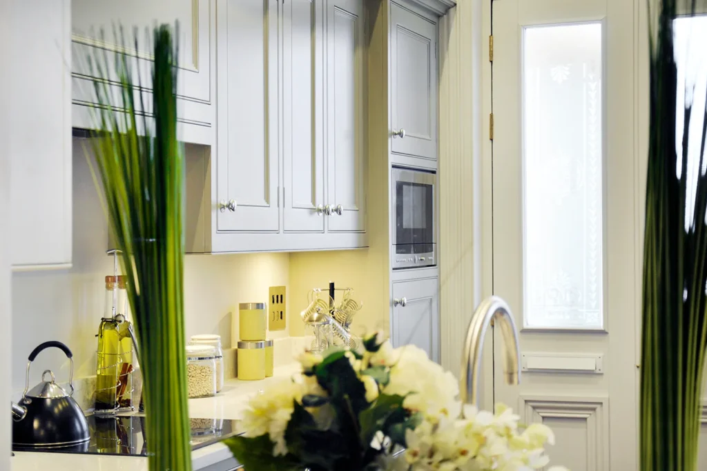 Handmade kitchen in Worthing with integrated microwave, Shaker-style cabinets, and elegant worktop